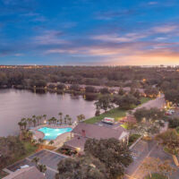overhead of property at dusk with lake